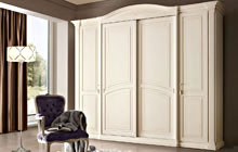 wWrdrobe with 2 central sliding doors and 2 hinged side doors, antique white glazed finish and ochre decorations